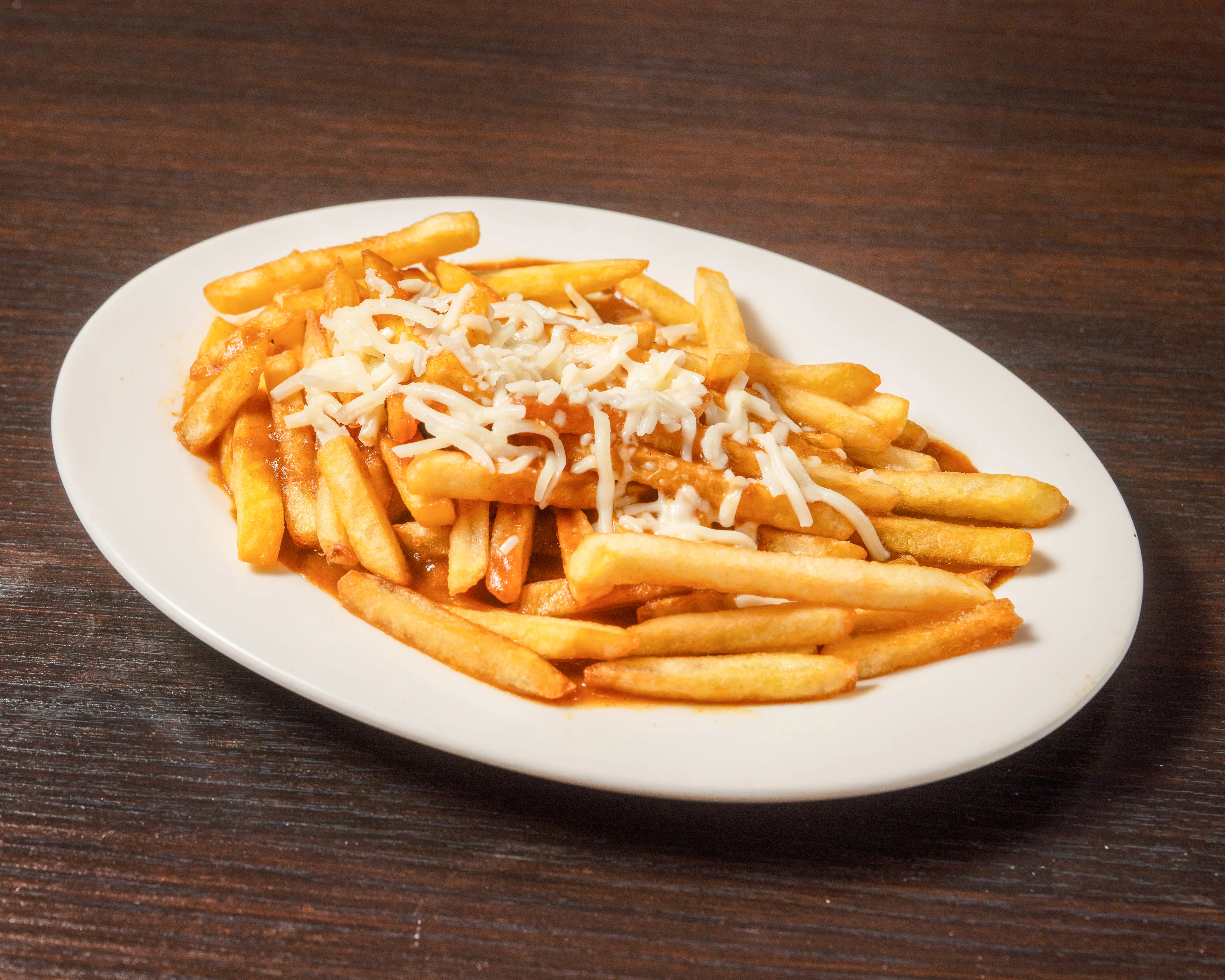 Loaded French fries with cheese and sauce