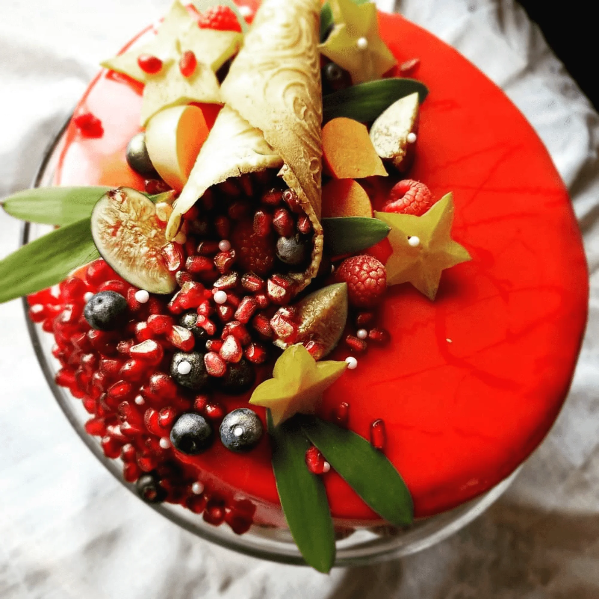 Vibrant fruit tart with pomegranate and berries