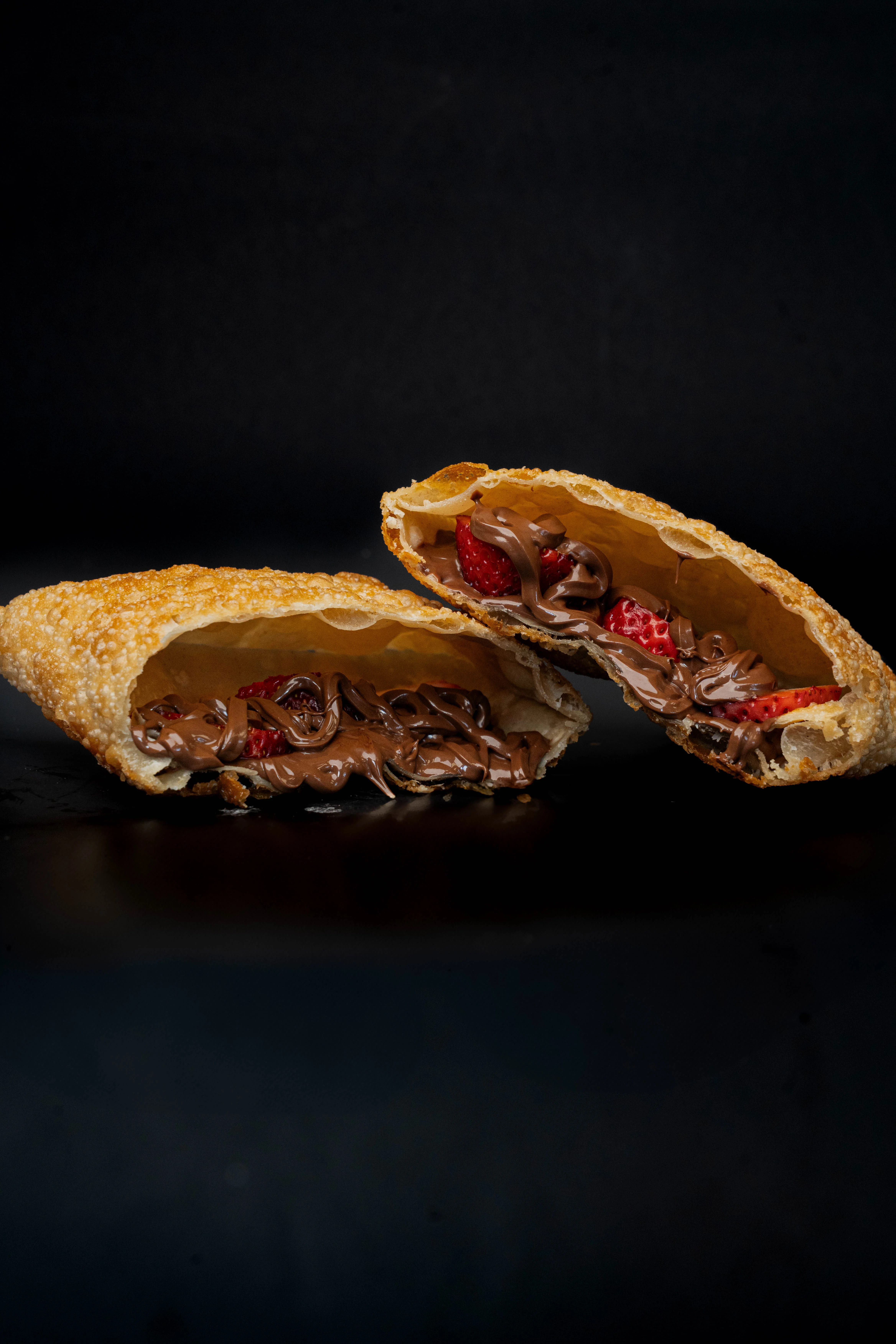 Crispy chocolate-stuffed empanadas with strawberries