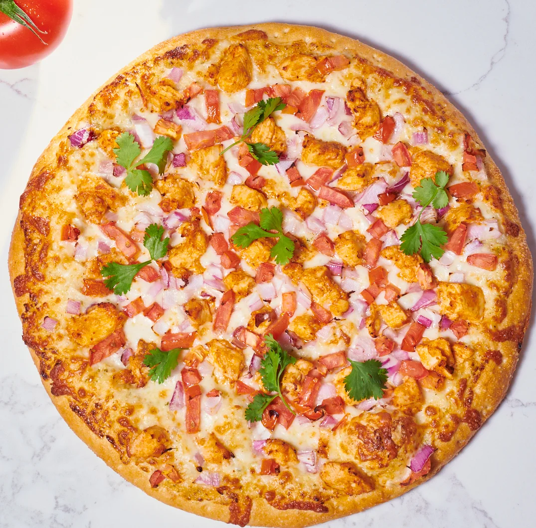 Spicy chicken pizza topped with fresh cilantro