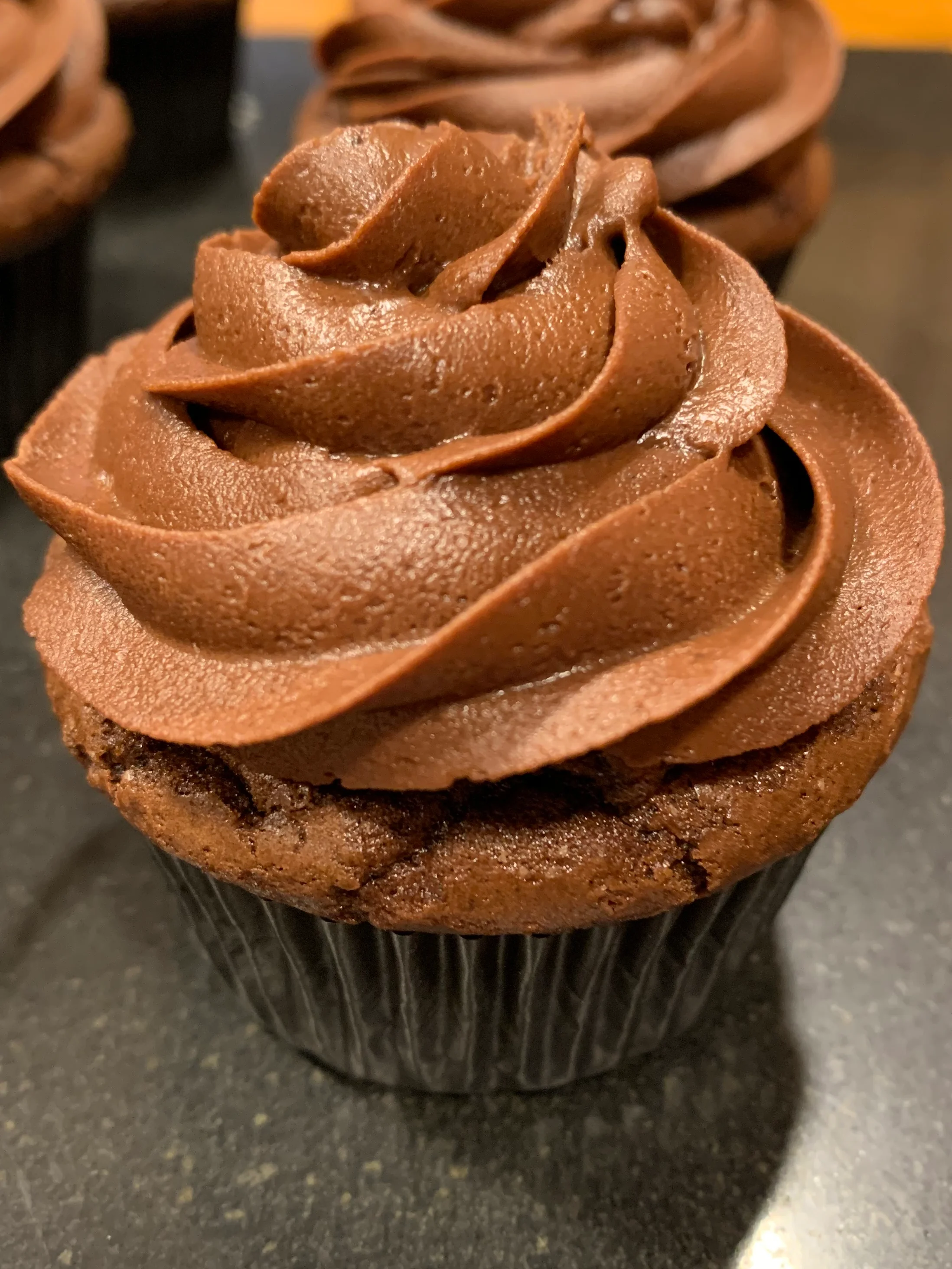 Decadent chocolate cupcake with rich frosting swirl