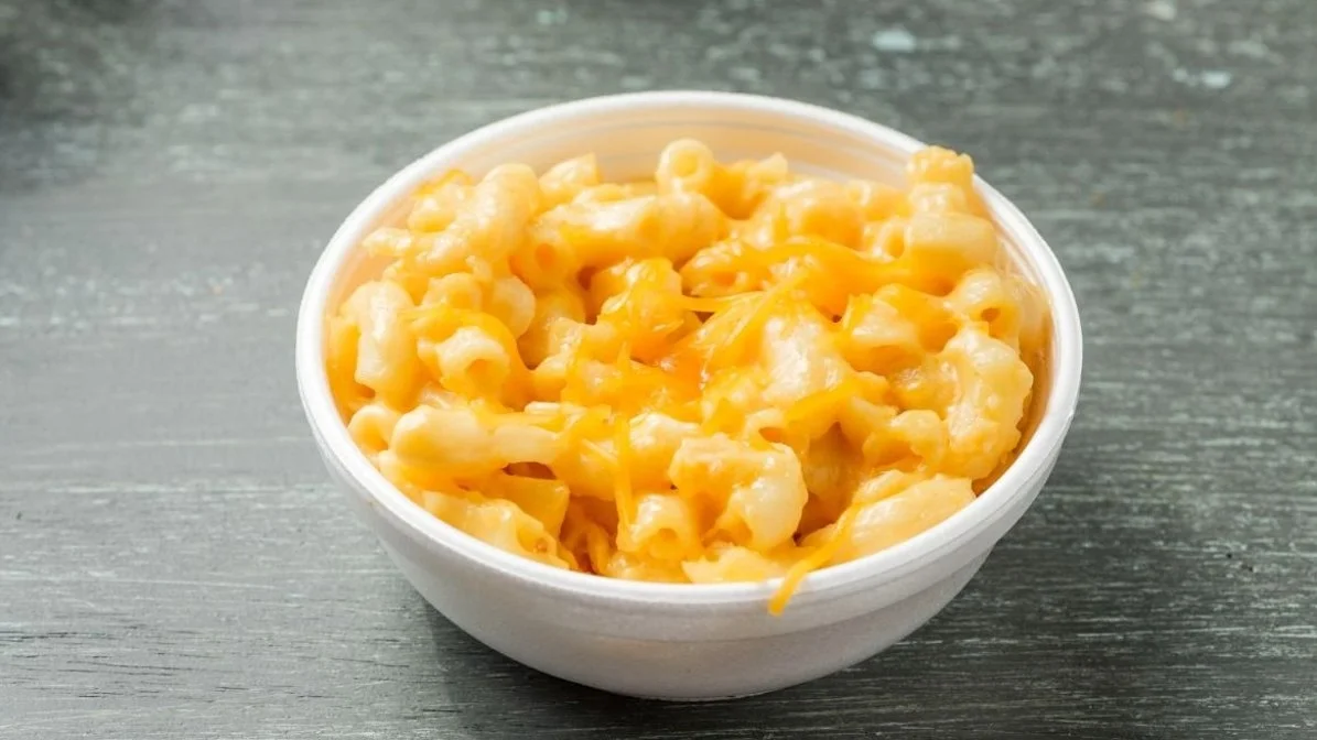 Mac and cheese from VooDoo BBQ in Pensacola, featuring creamy elbow pasta topped with melted cheddar.
