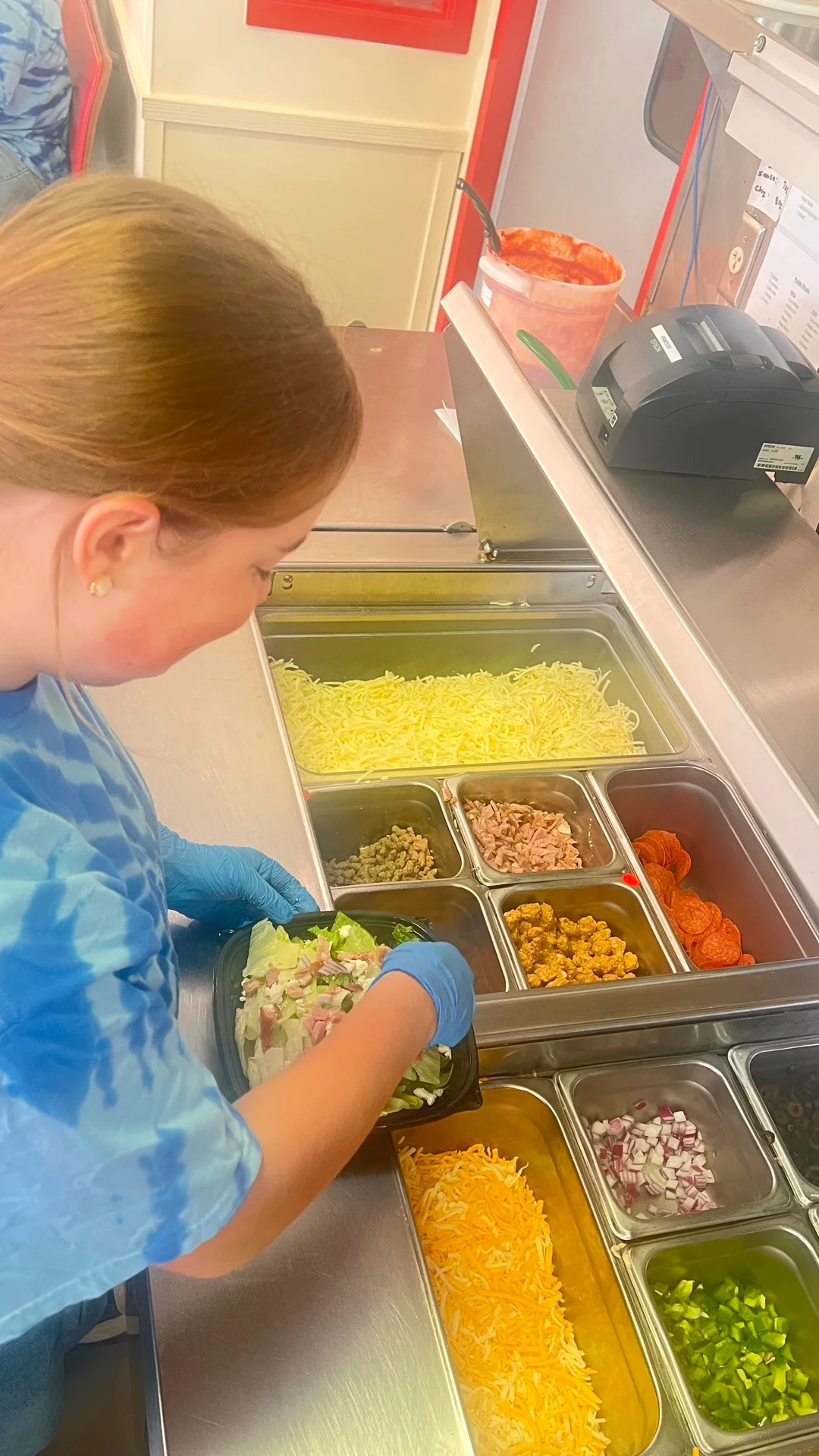 Preparing a fresh salad in a casual dining restaurant