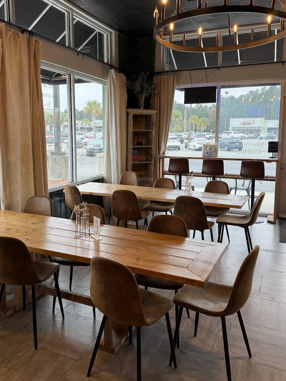 Cozy restaurant interior with wooden tables and modern lighting fixtures