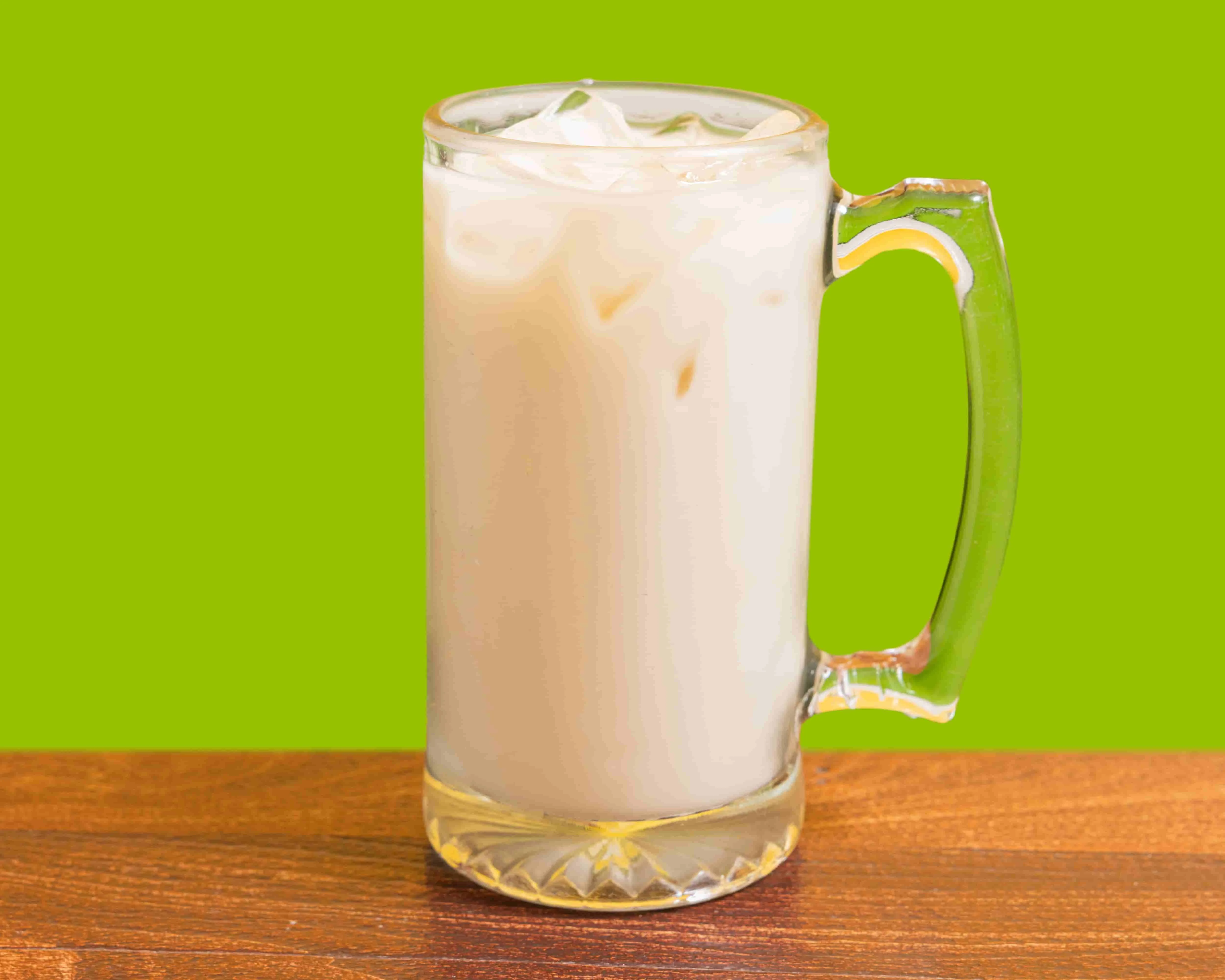 Refreshing glass of Thai iced tea with ice