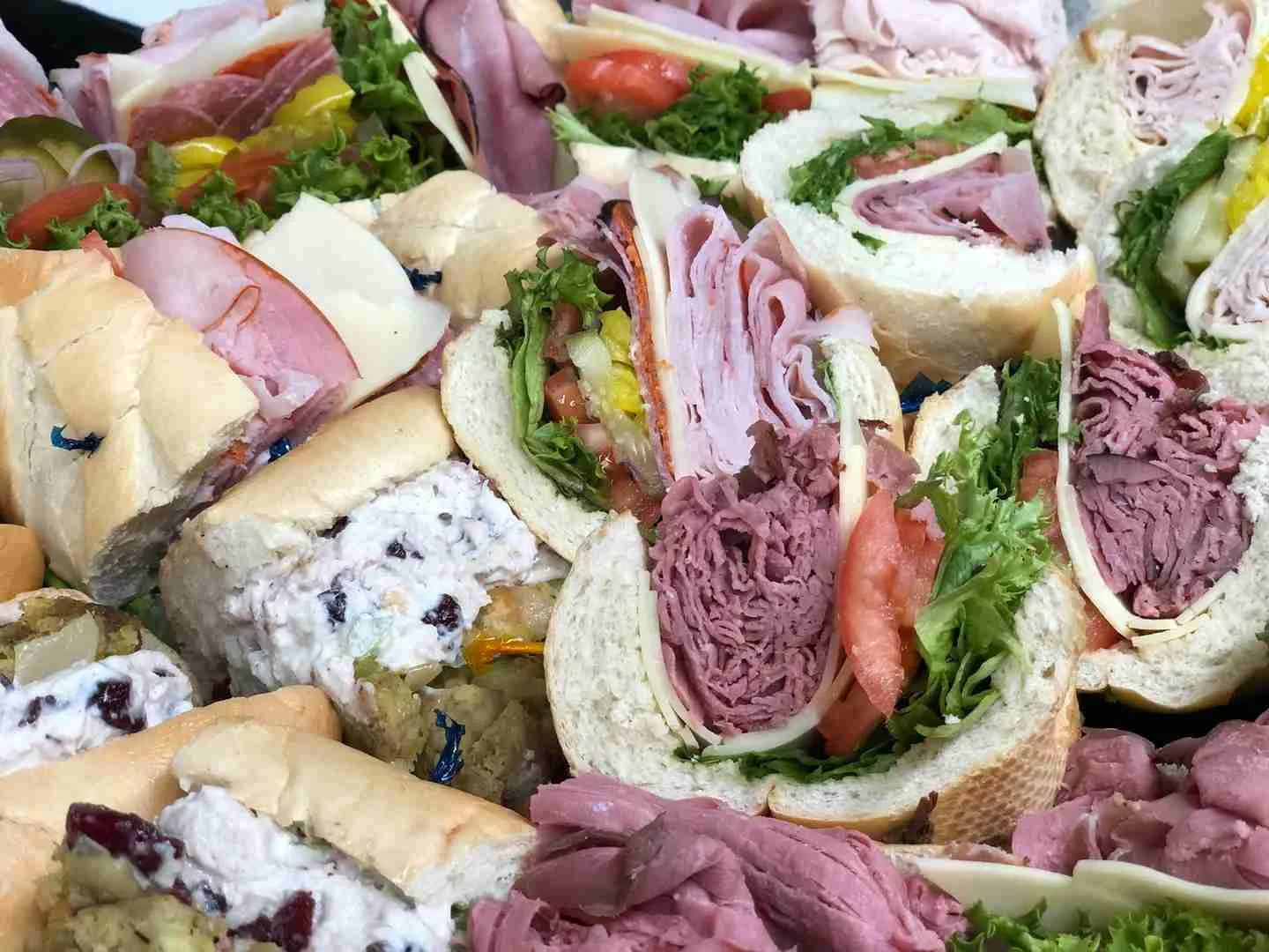 Assorted deli sandwiches on a platter