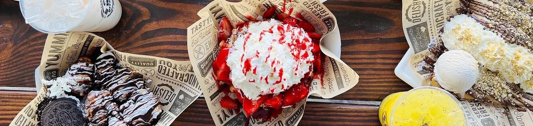 Assorted dessert crepes with toppings and ice cream