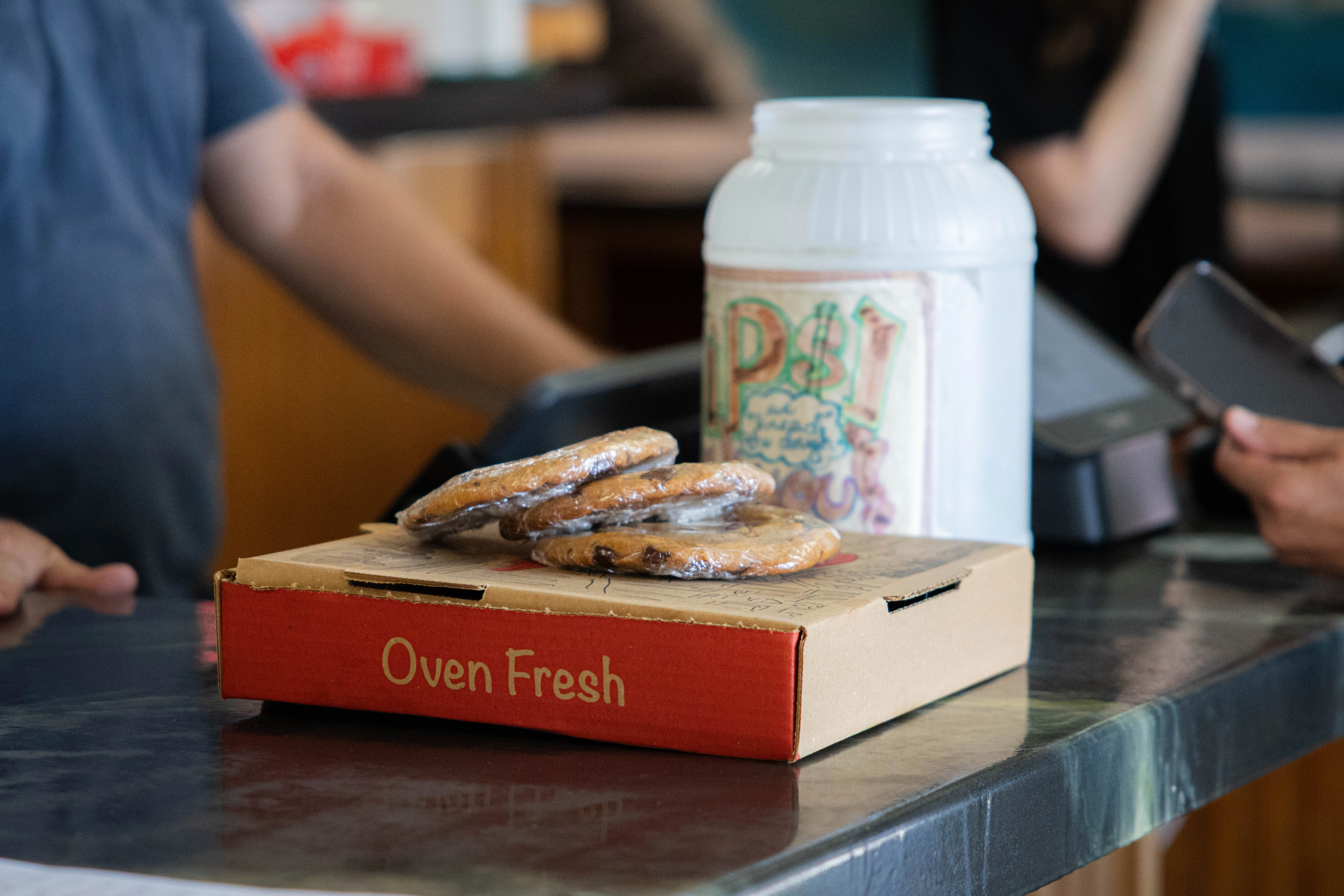 Freshly baked cookies in a takeout box