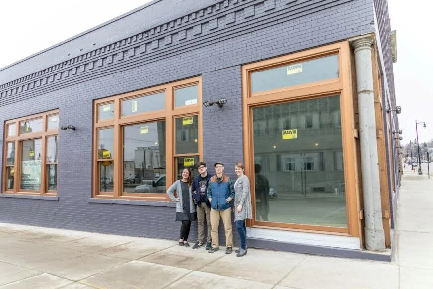 Group of restaurant owners outside their new establishment