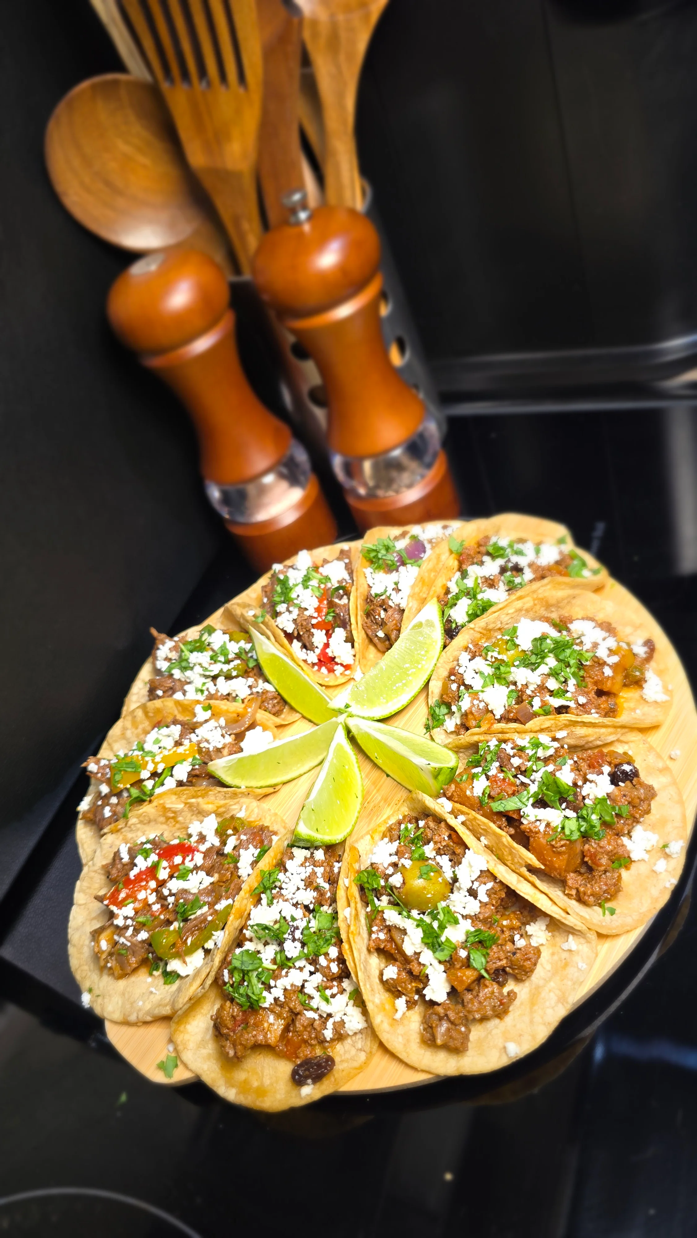 Delicious Mexican tacos served with lime and fresh toppings
