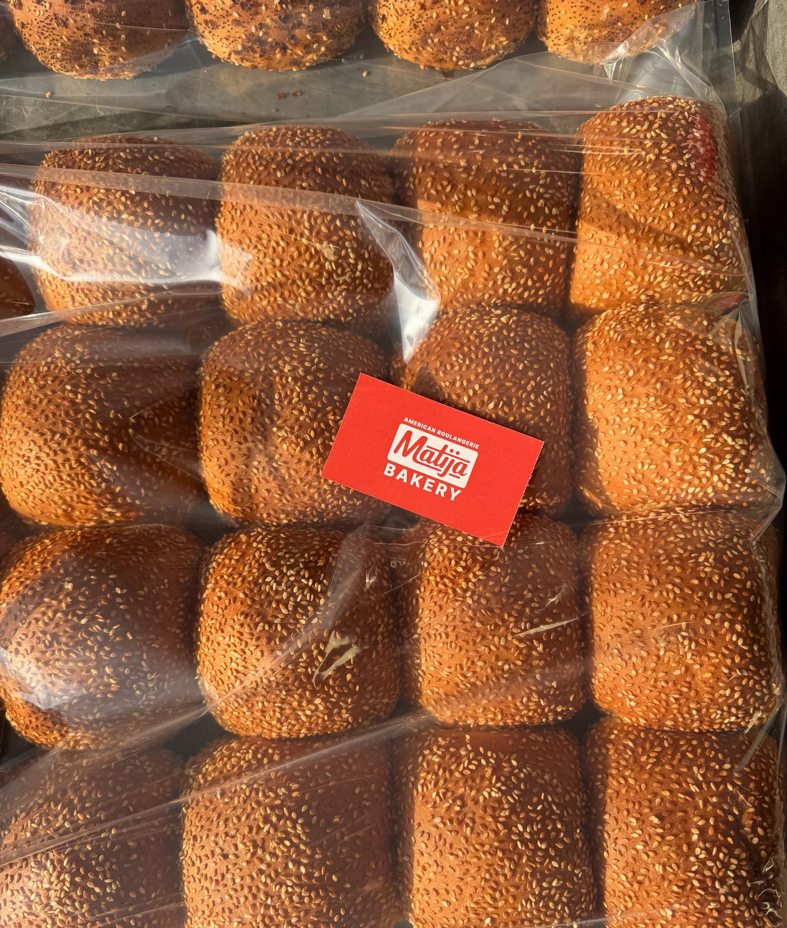 Freshly baked sesame rolls from a local bakery
