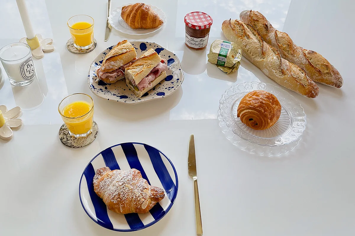 Sunday brunch at home featuring croissants, baguette, and French products from La Boulangerie & Co Logan Square.