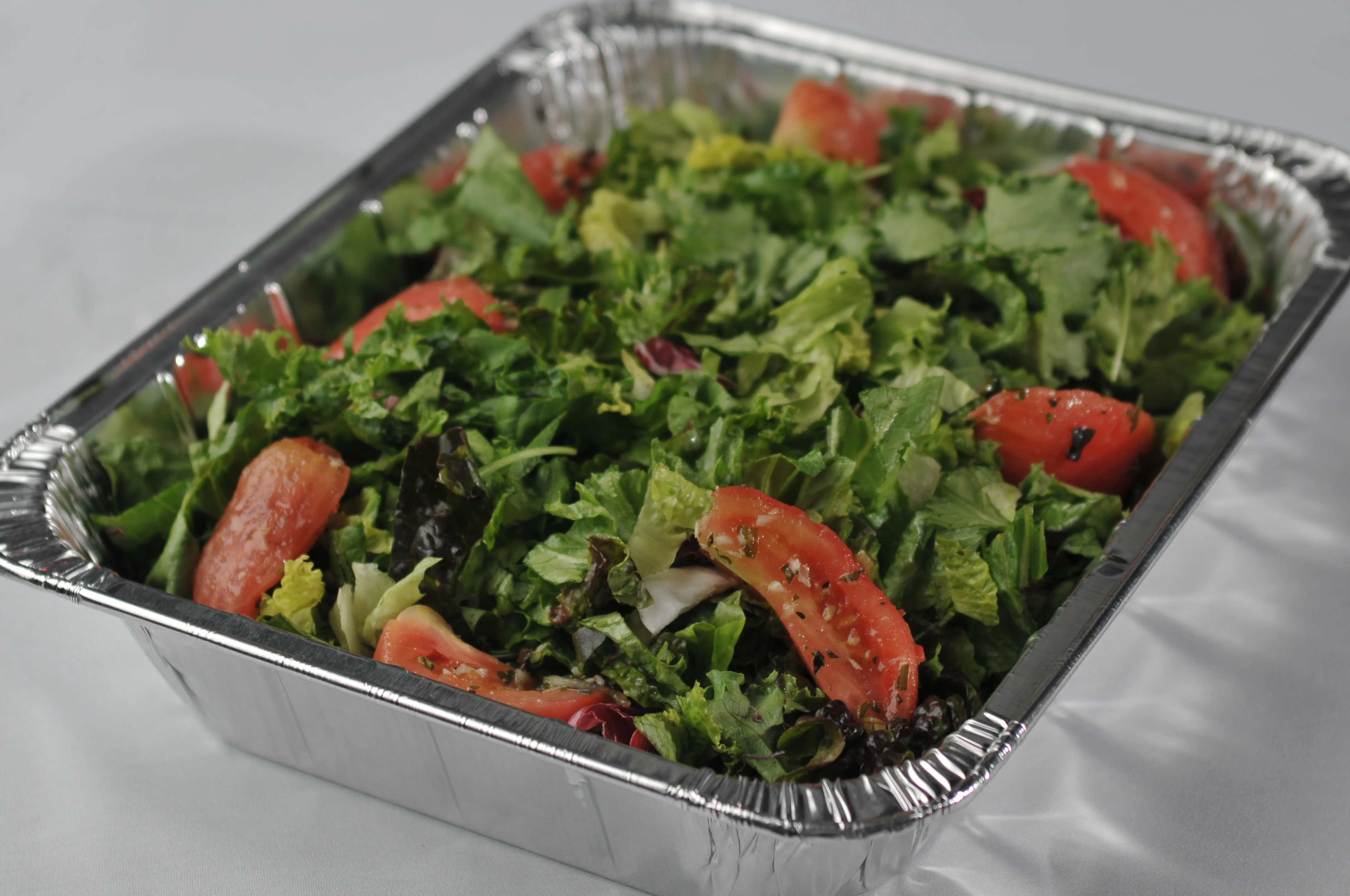 Fresh house salad prepared for corporate takeout from Post Oak Grill Downtown Houston.