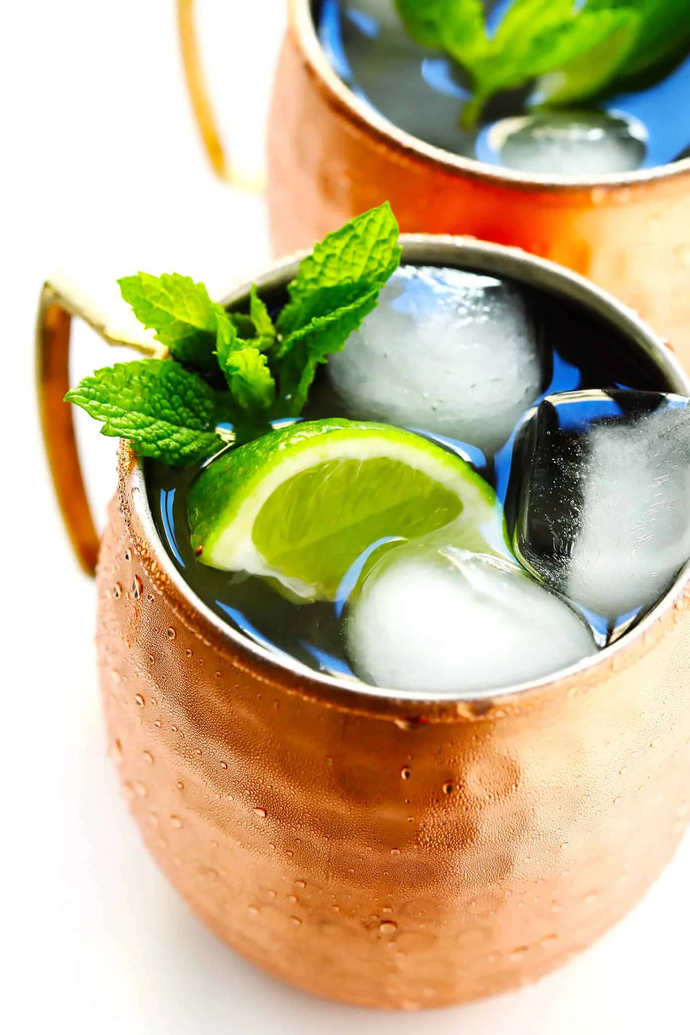 Refreshing Moscow Mule in a copper mug with mint and lime