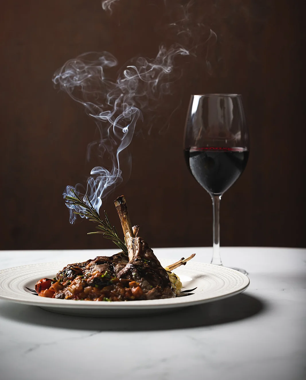 Smoky lamb chop with red wine in a fine dining setting