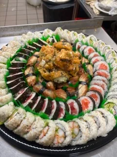 Assorted Japanese sushi platter with rolls and tempura