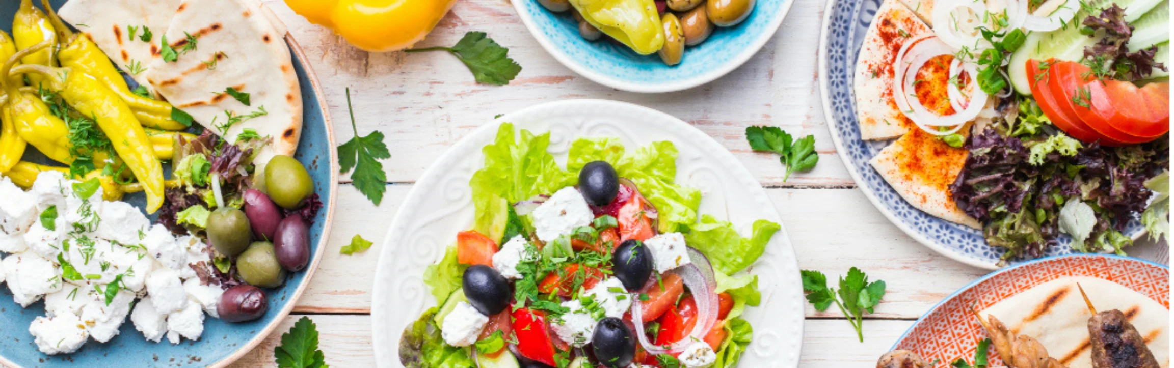 Mediterranean mezze platter with fresh salads and cheeses