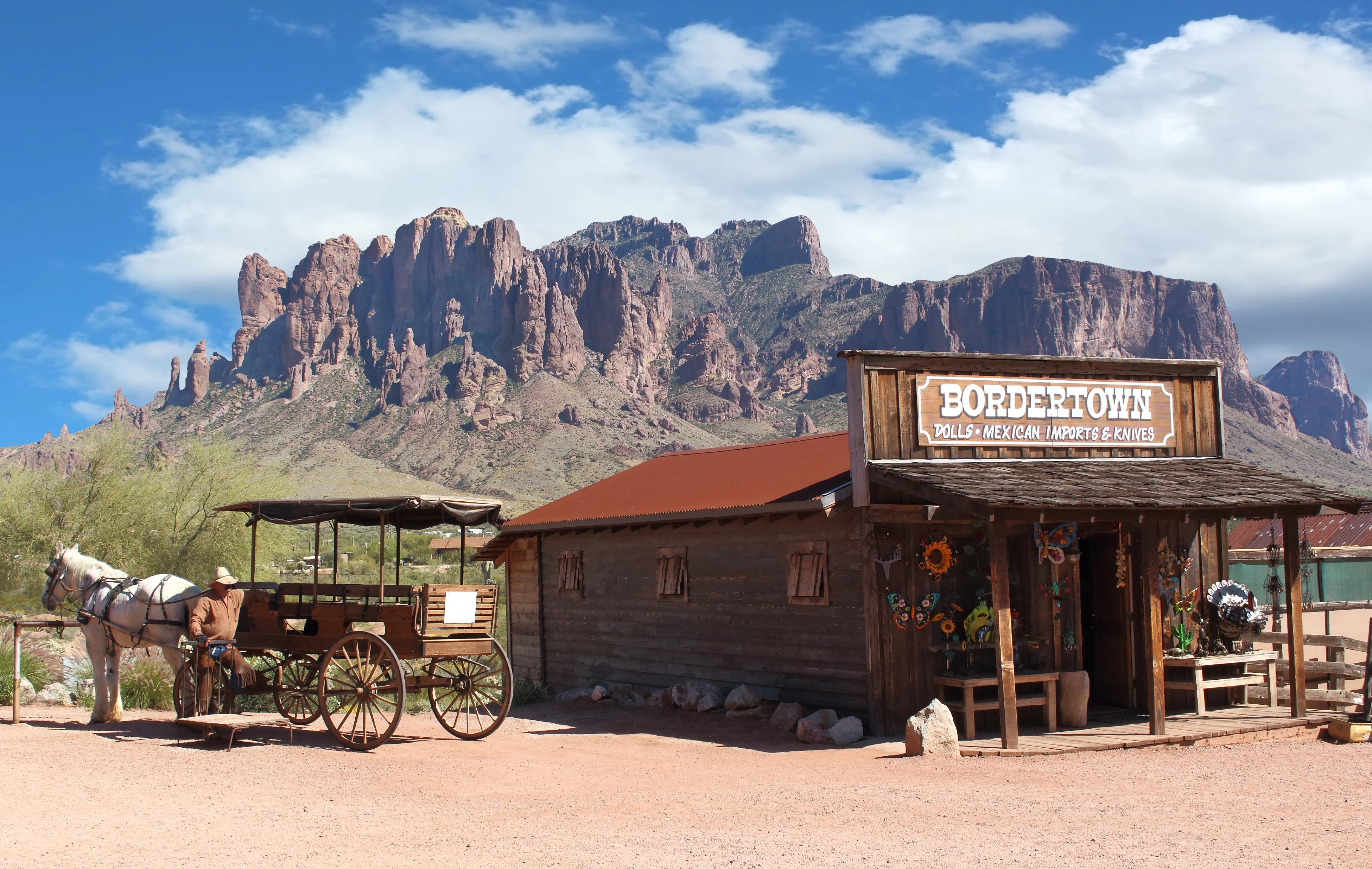 Historic western storefront with mountains in background