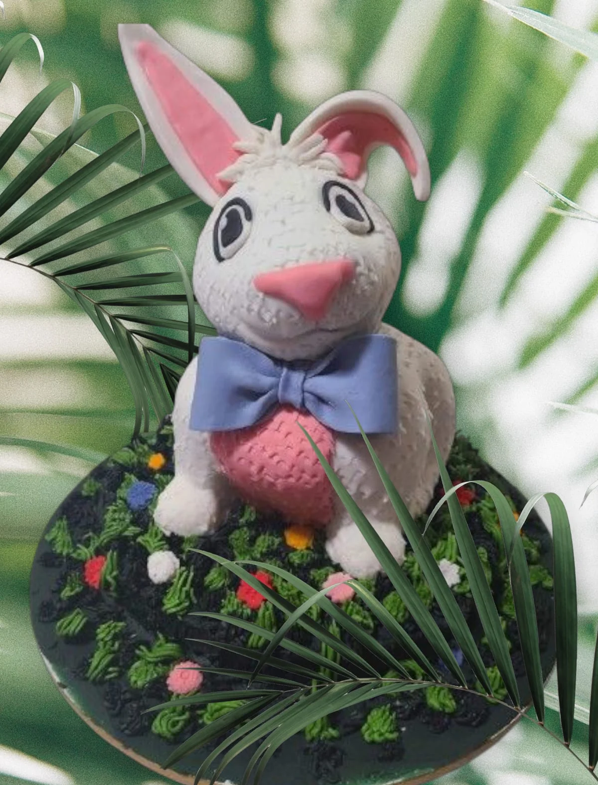 Decorative cake featuring a bunny on a floral base