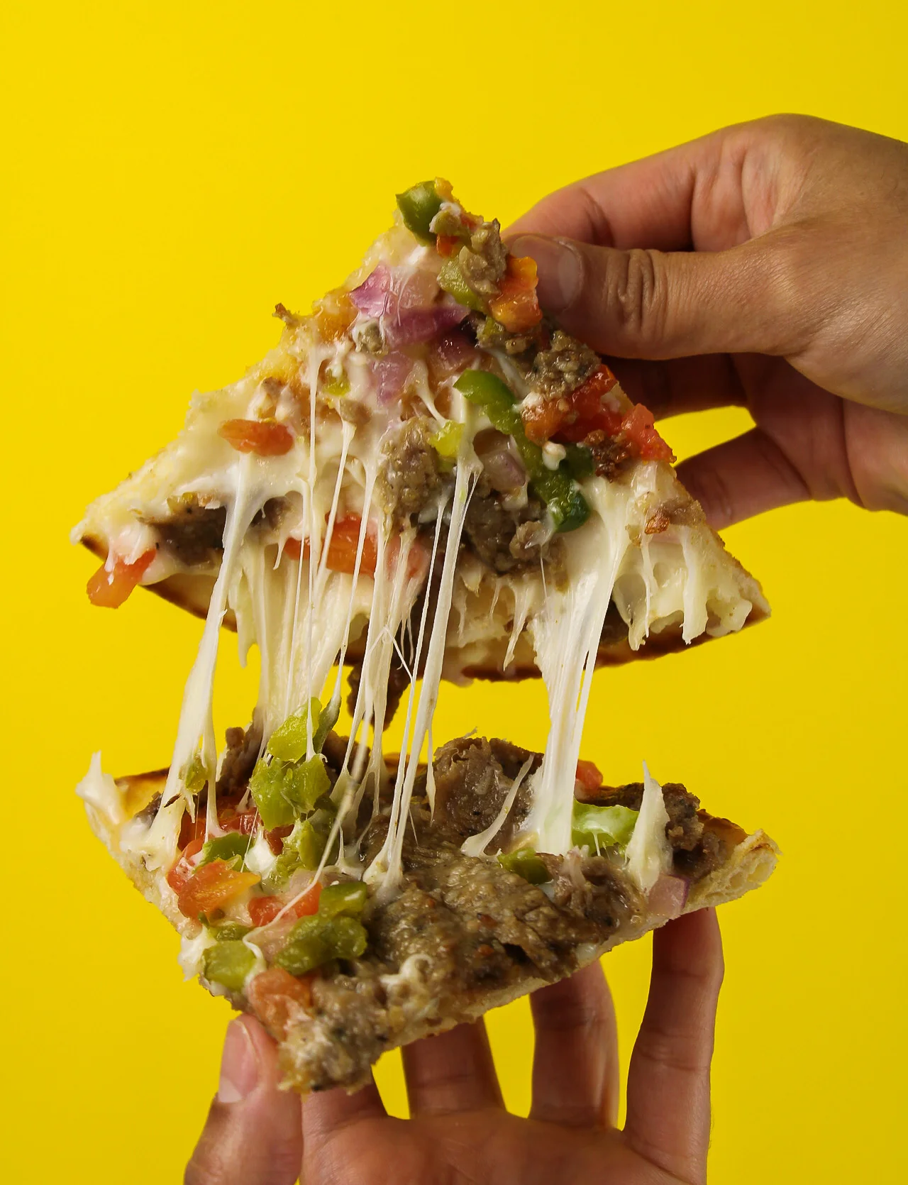Two pieces of fully loaded Pita bread