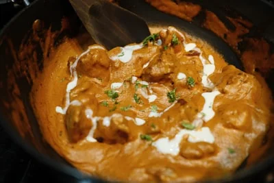 Creamy butter chicken curry in a pot