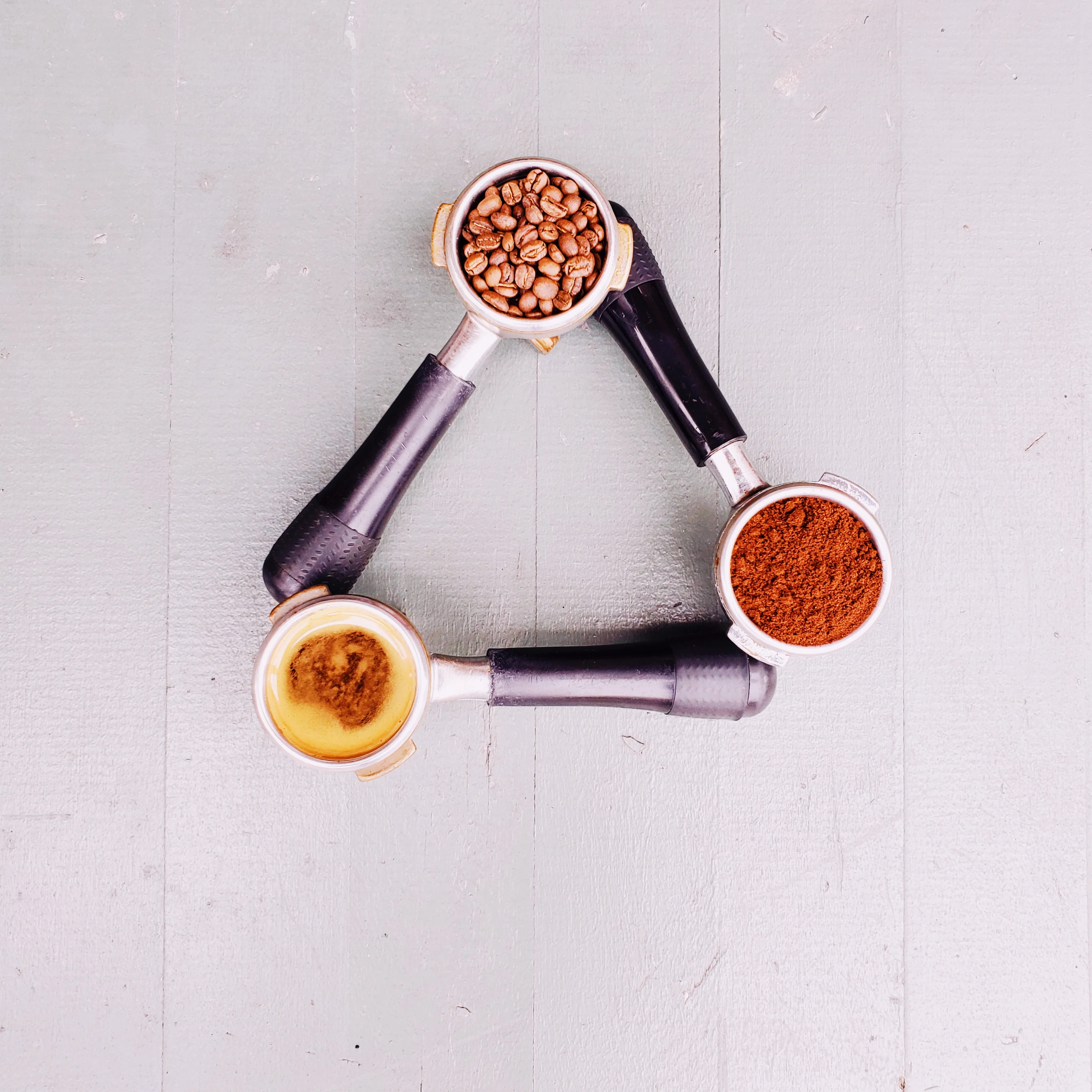 Coffee preparation tools arranged in a triangle
