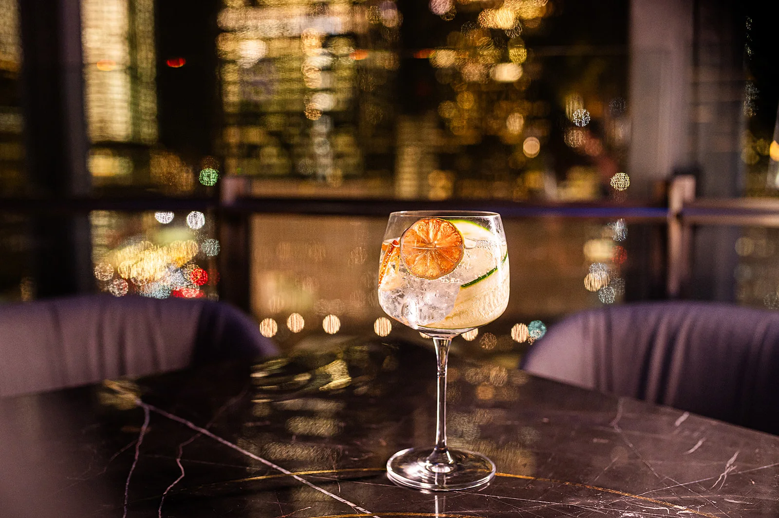 Refreshing gin and tonic cocktail with citrus garnish