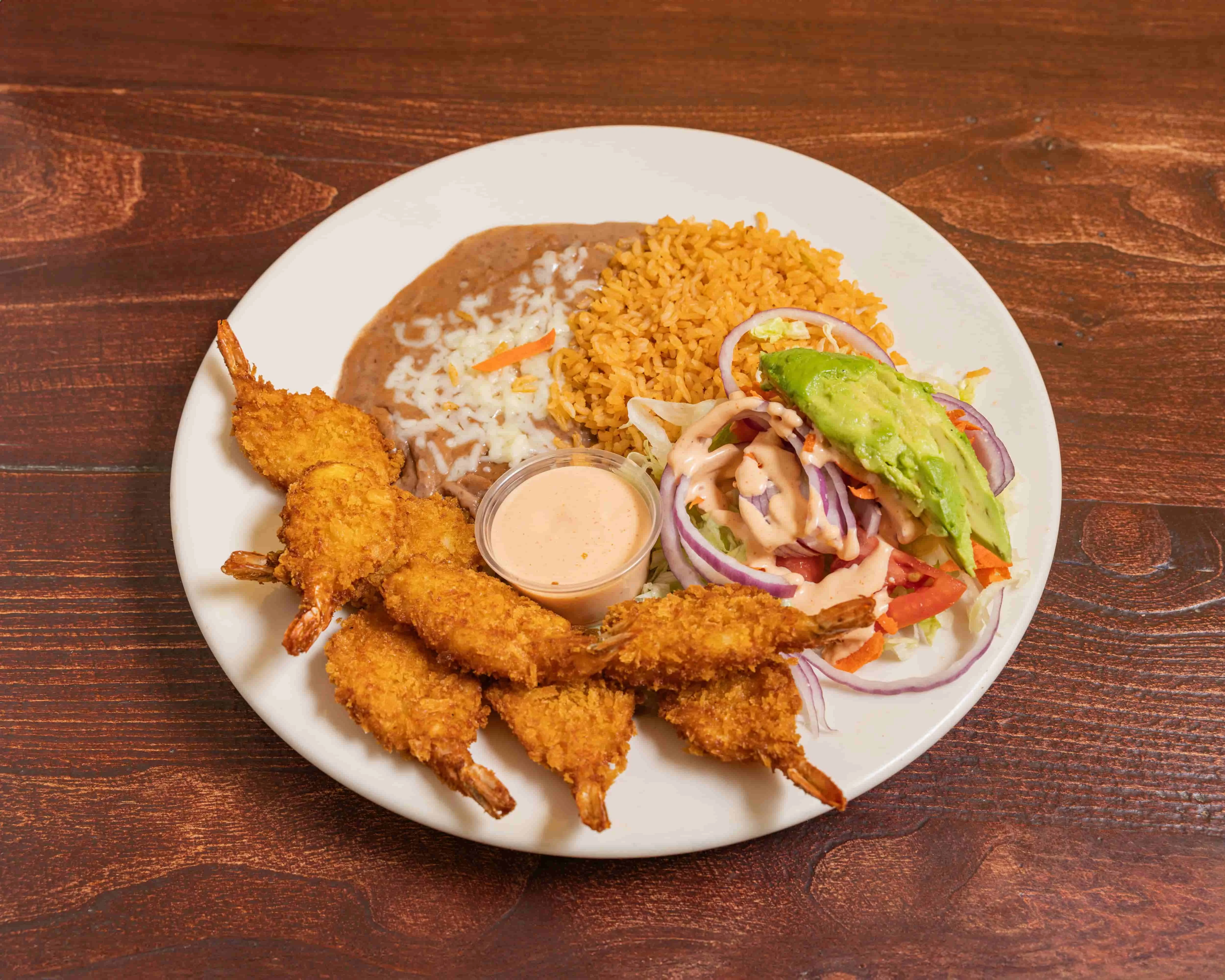 Crispy shrimp plate with rice and beans, a classic Mexican dish