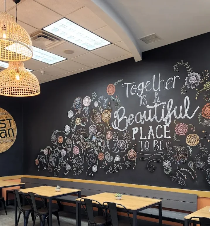 Cozy restaurant interior with artistic chalkboard wall