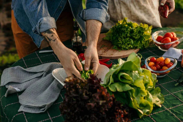 Preparing fresh salad ingredients outdoors