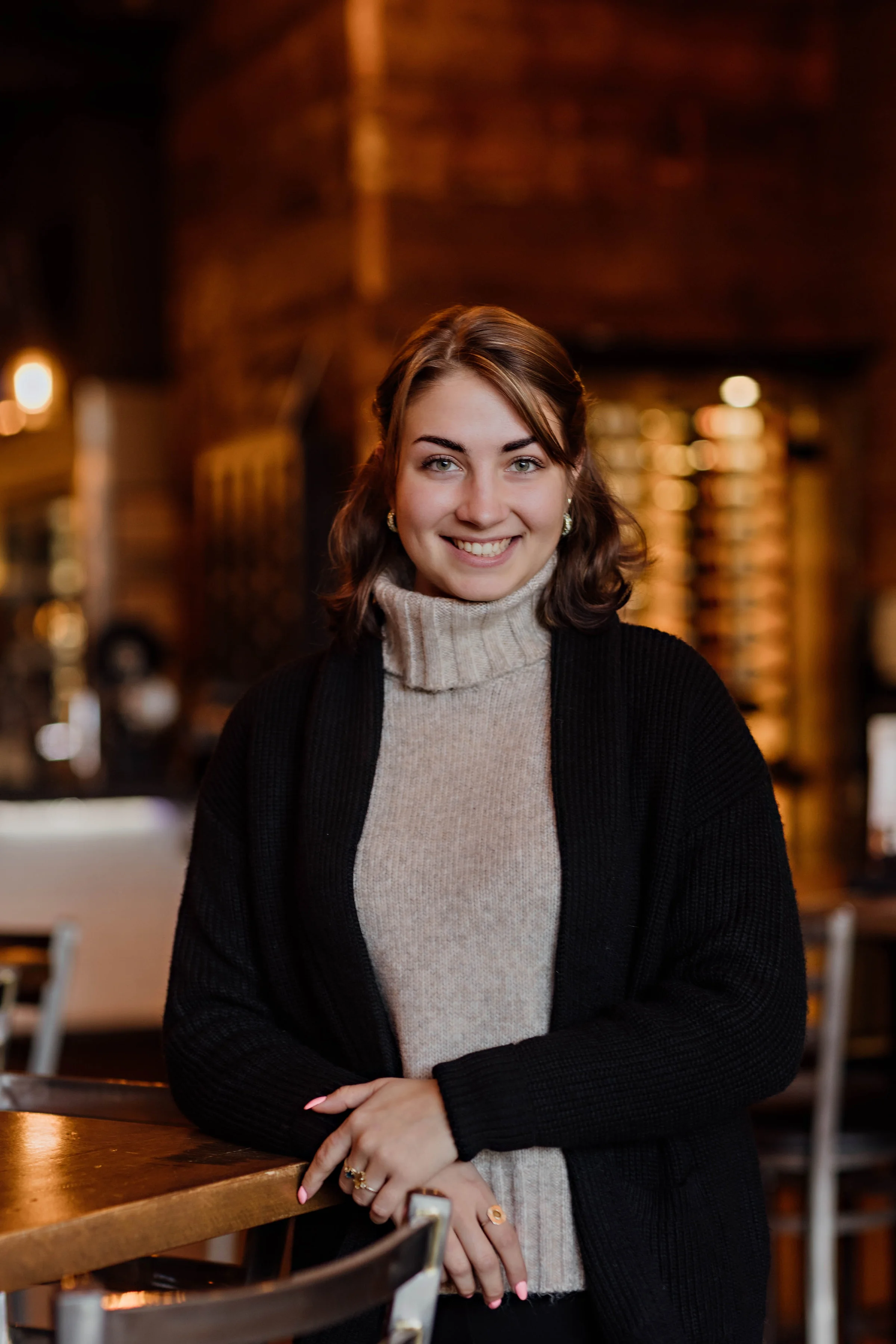 Smiling woman in a cozy restaurant setting