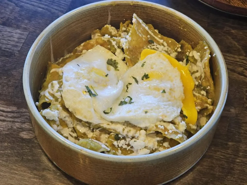 Chilaquiles topped with fried eggs and cheese