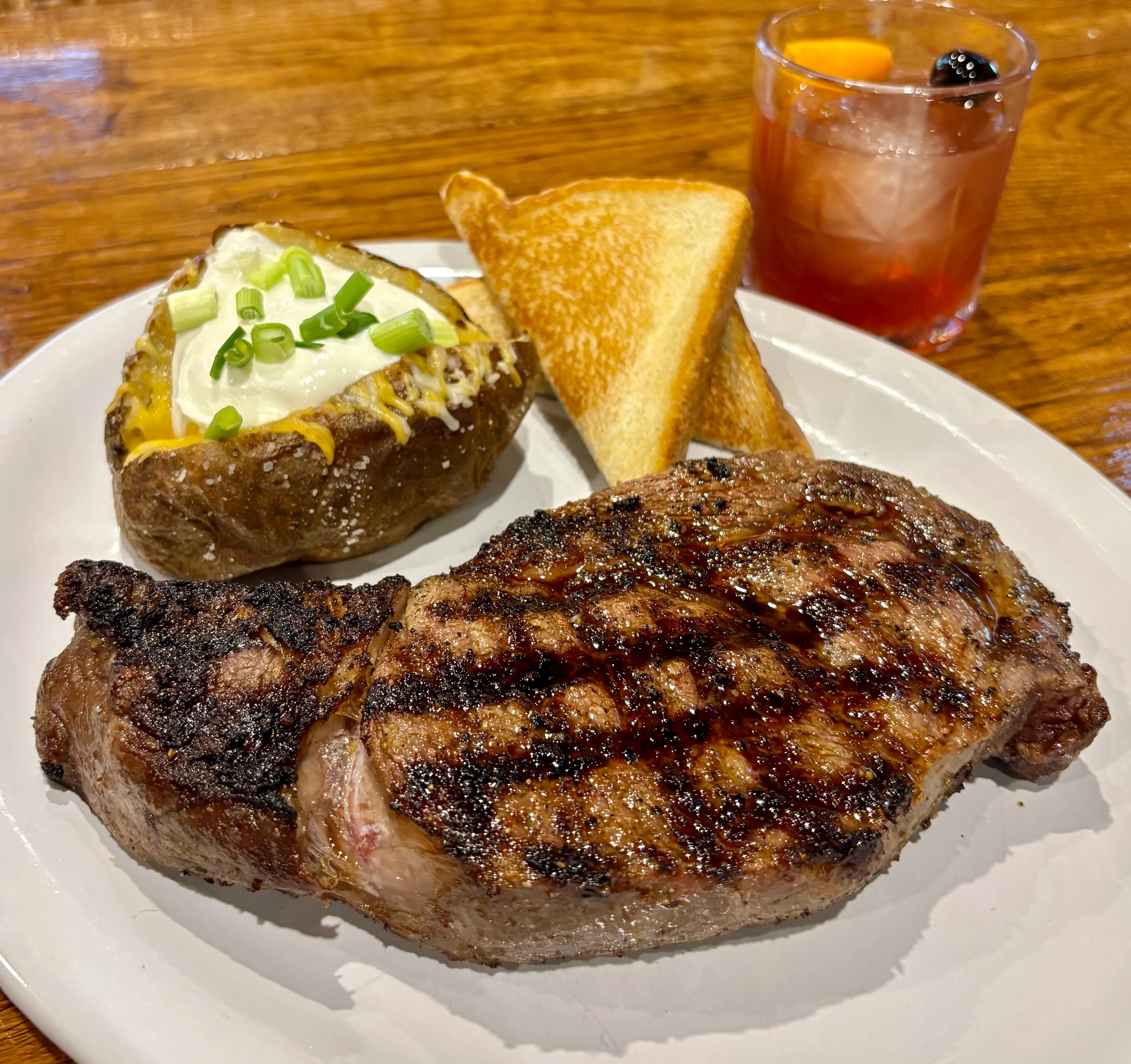 Delicious gourmet burger with fresh toppings on a wooden table