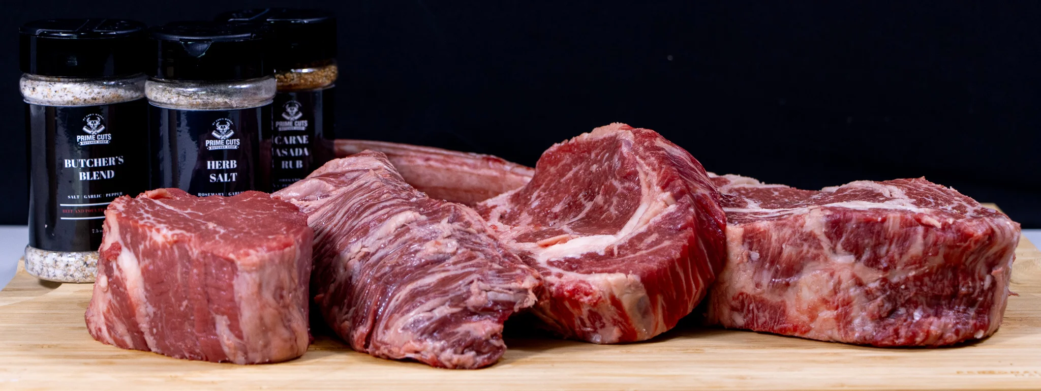 Selection of premium cuts of beef with seasoning blends