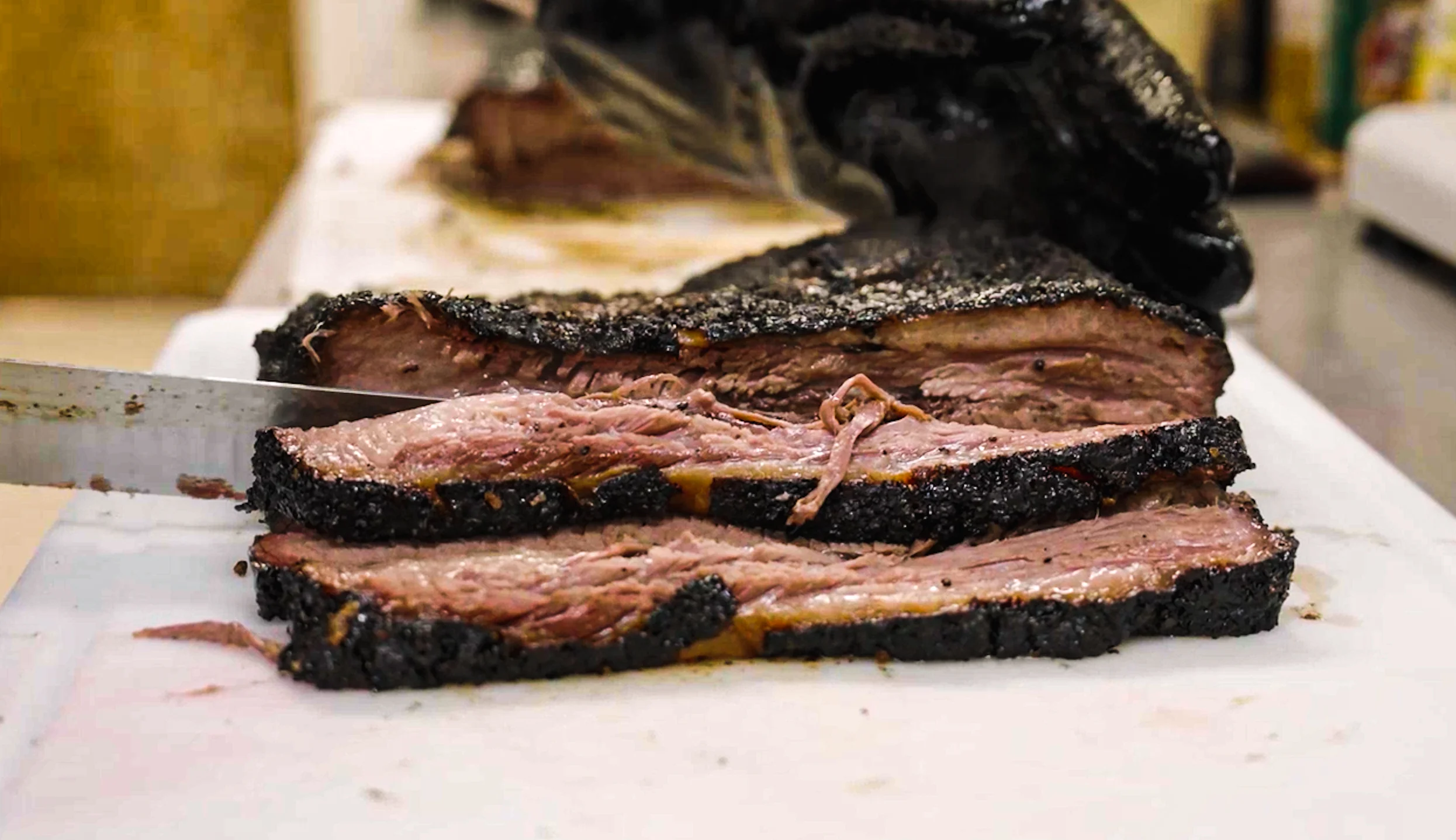 Smoked brisket slices on a cutting board