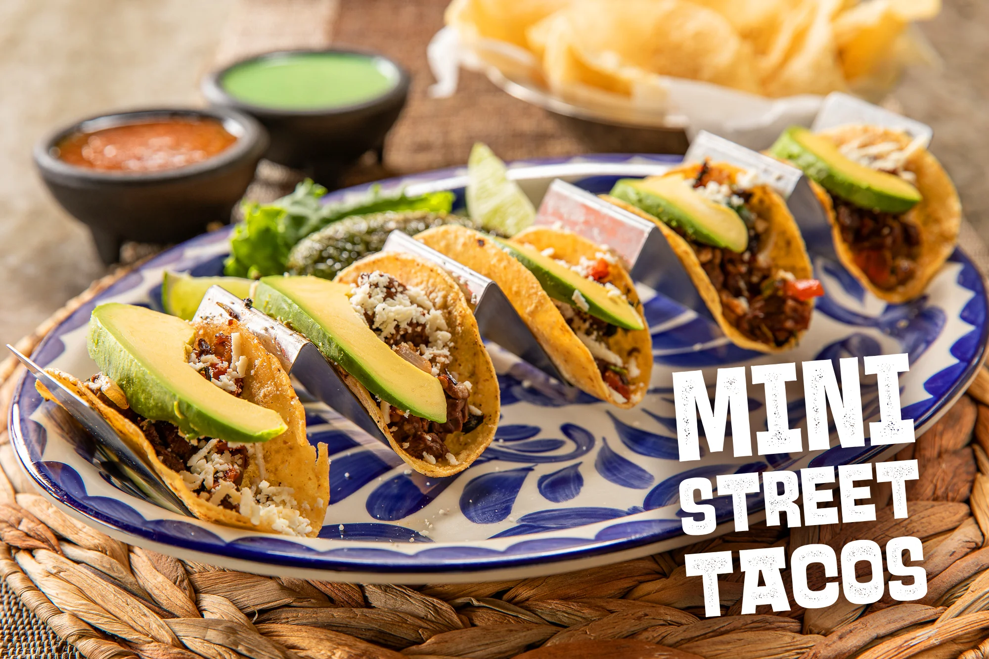 Mini street tacos served on a decorative plate
