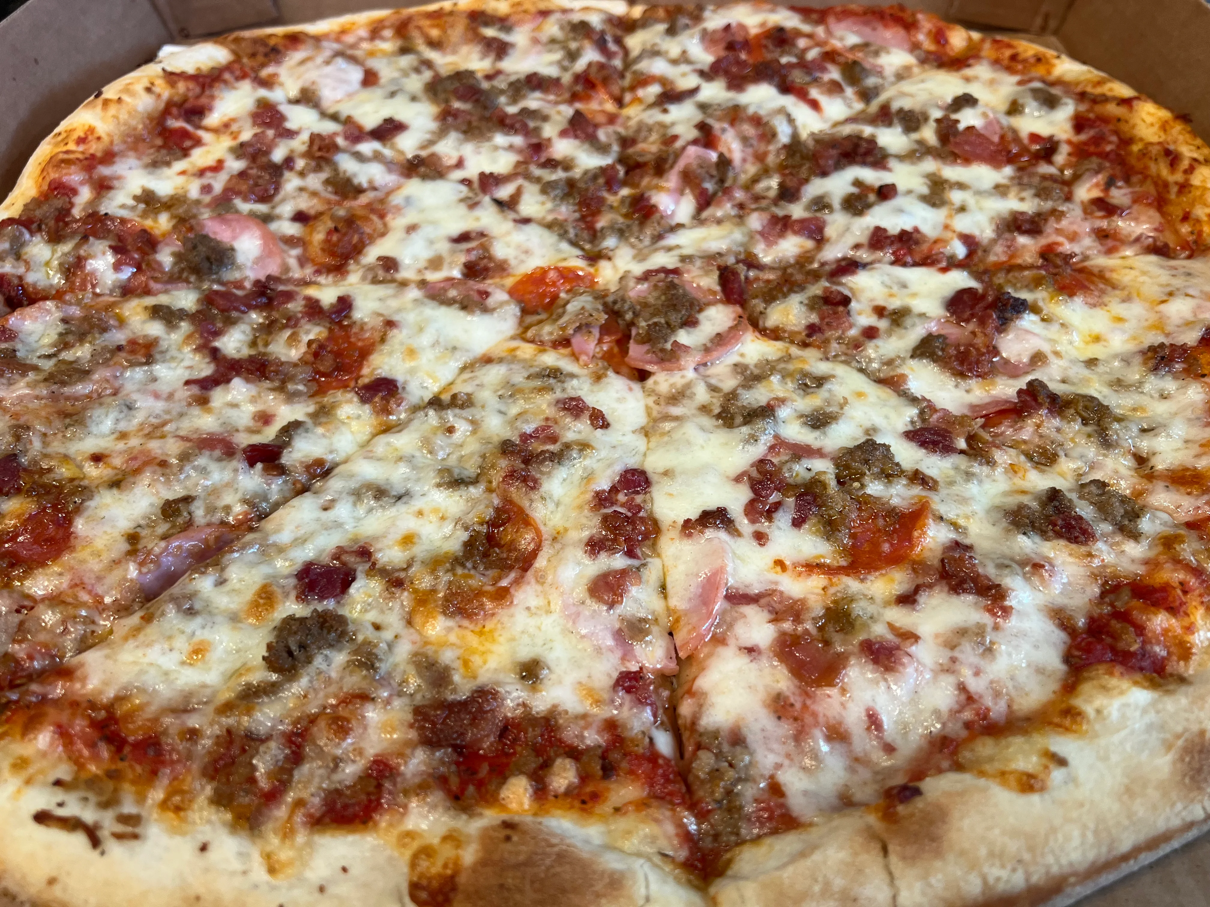 Loaded meat lover's pizza with cheese and toppings