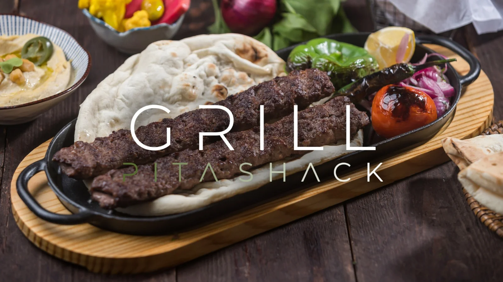 Sizzling kebab platter with flatbread and grilled vegetables