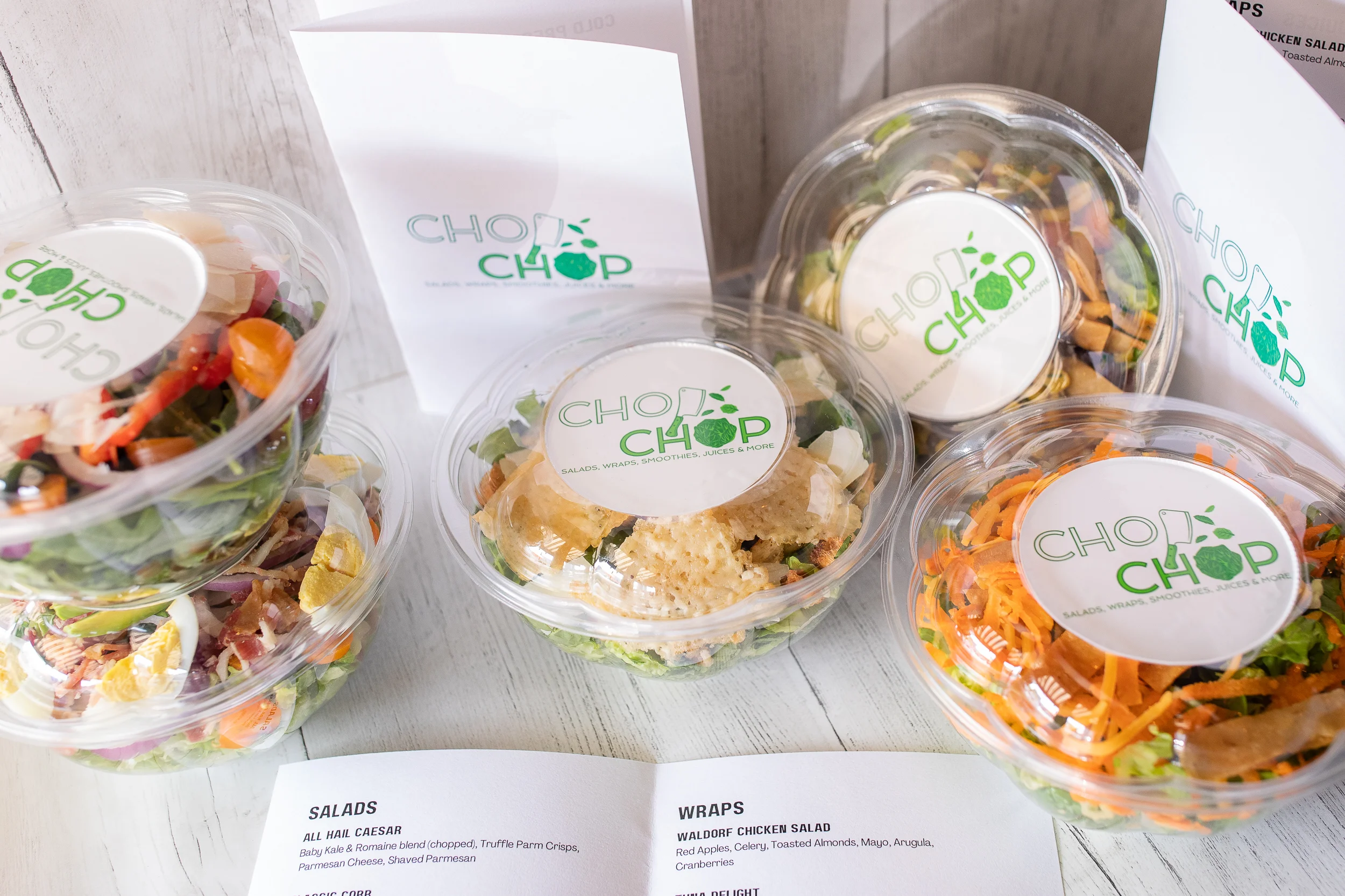 Assorted fresh salads and wraps from a modern salad bar