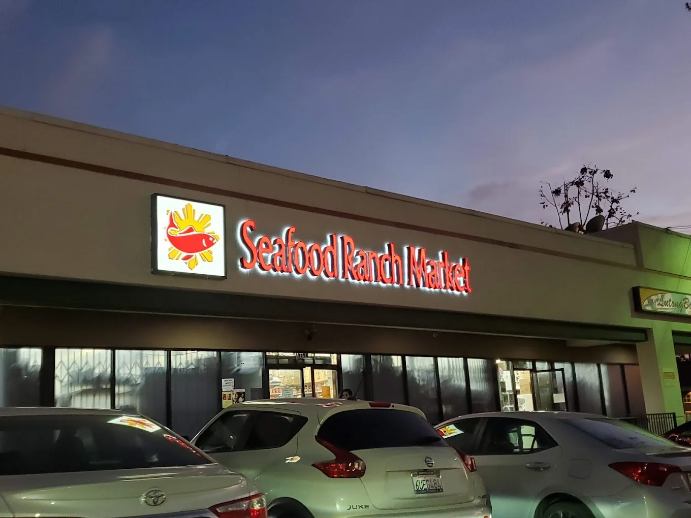 Exterior view of Seafood Ranch Market with illuminated signage