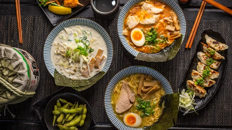 Japanese ramen bowls with pork, egg, and gyoza