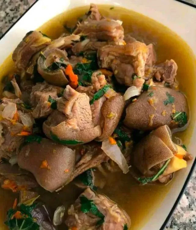 Nigerian peppered goat meat stew with herbs