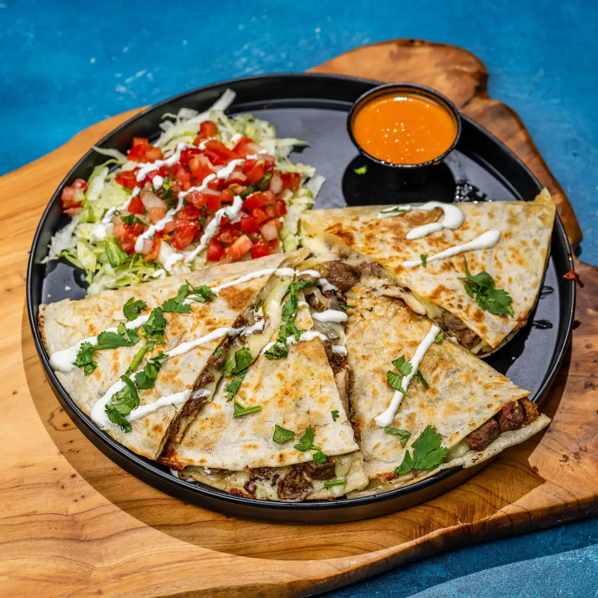 Crispy Mexican quesabirria tacos with consommé dipping sauce