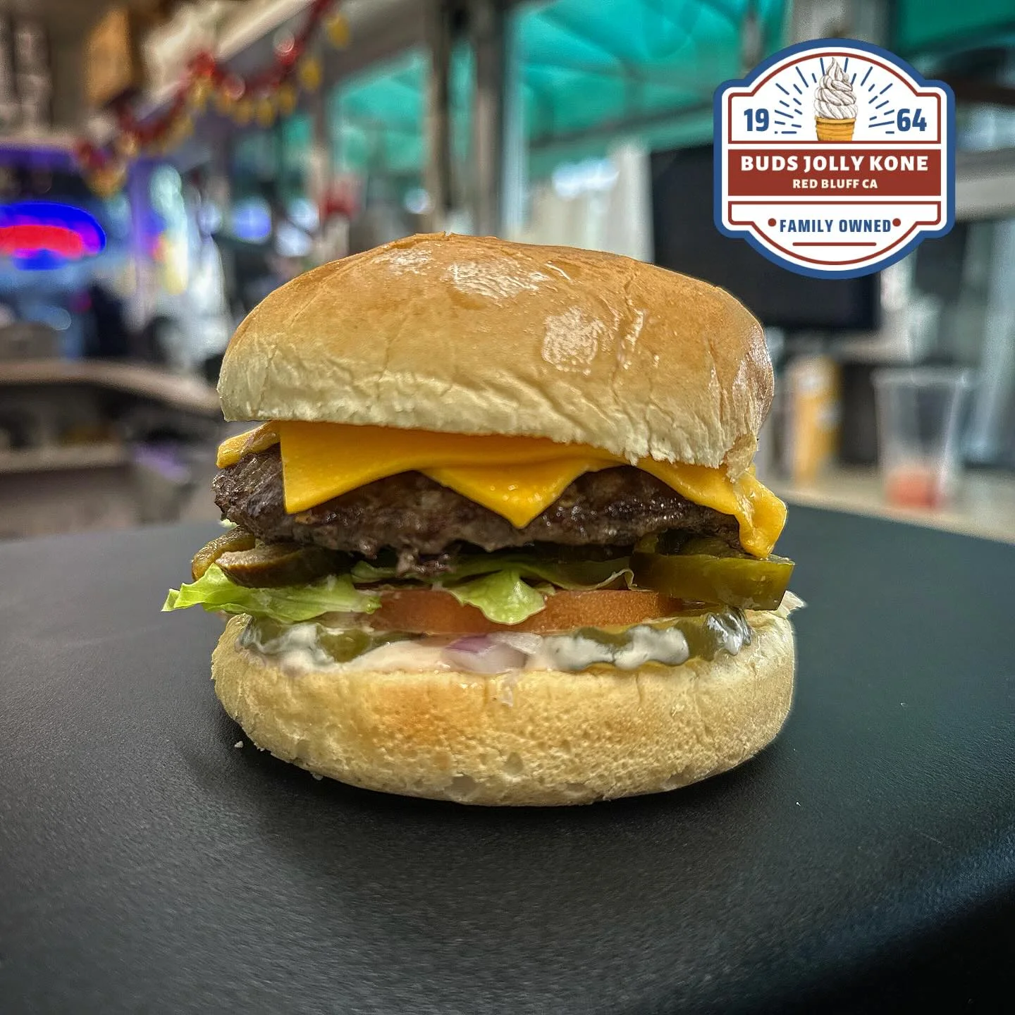 Classic American cheeseburger with lettuce and tomato