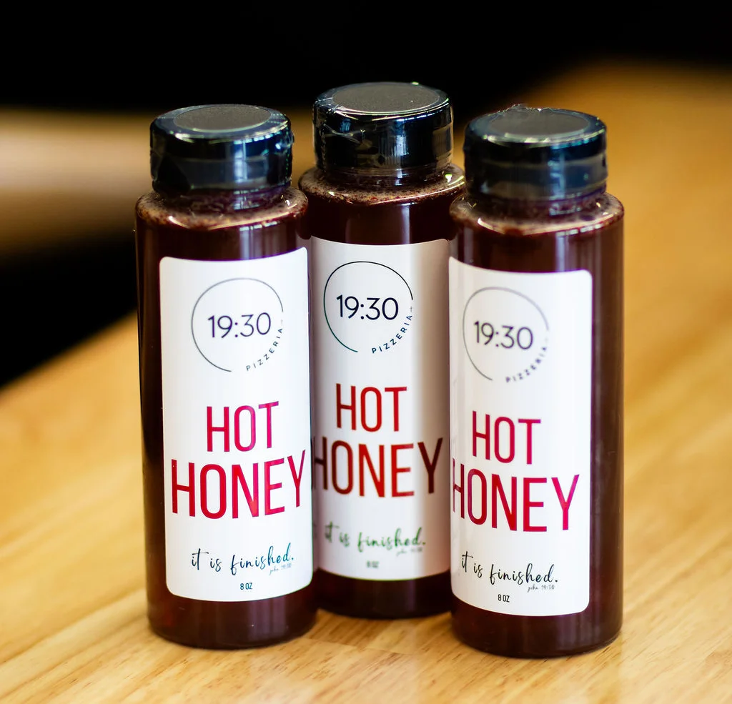 Bottles of hot honey from a pizzeria