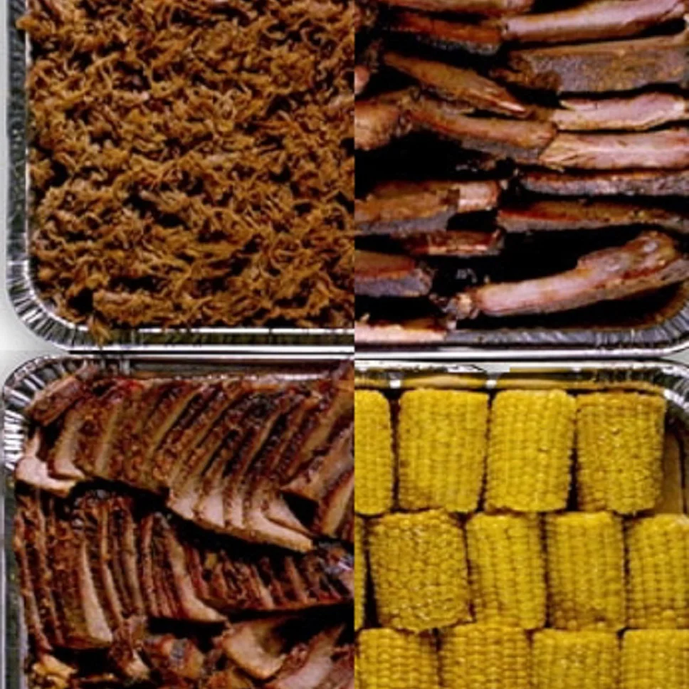 Assorted barbecue platter featuring brisket, pulled pork, and ribs