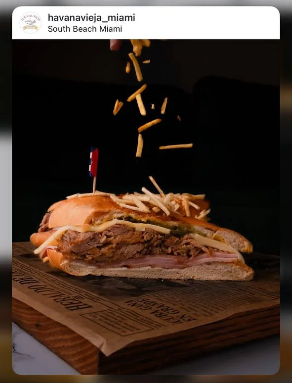 Cuban sandwich with layers of meat and crispy fries