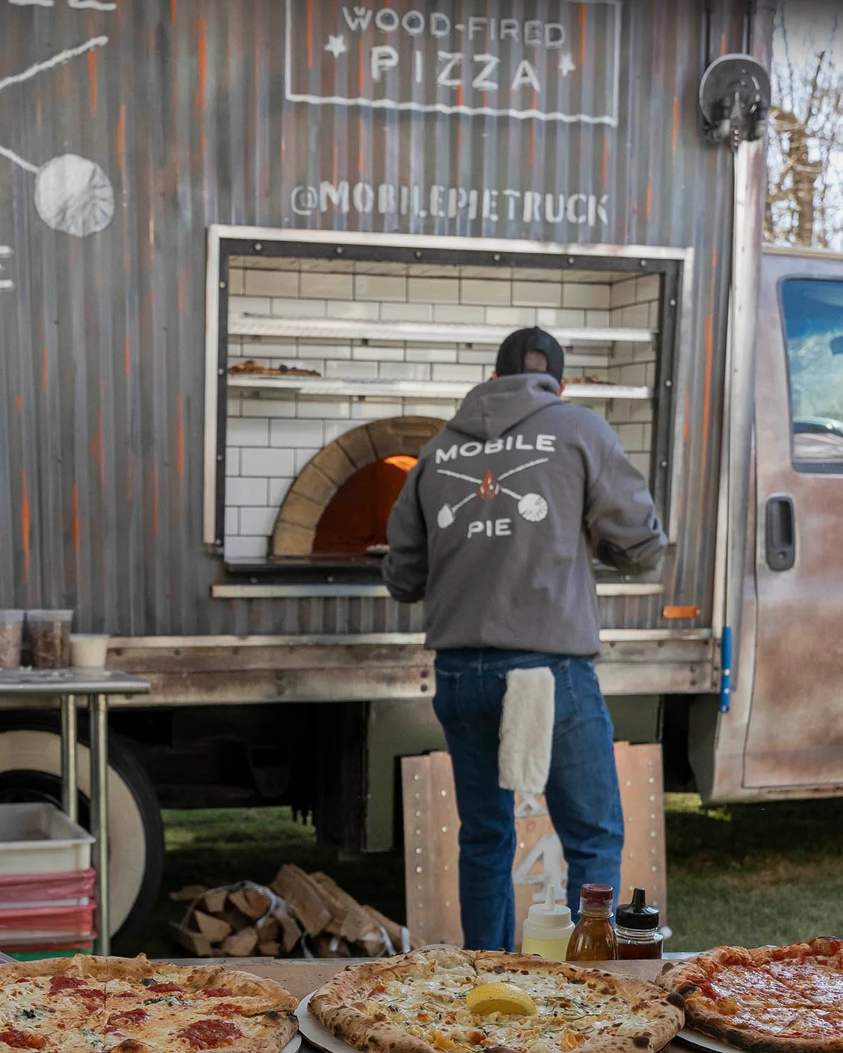 Exit 4 Food Hall wood-fired pizza truck at an outdoor event in Westchester County