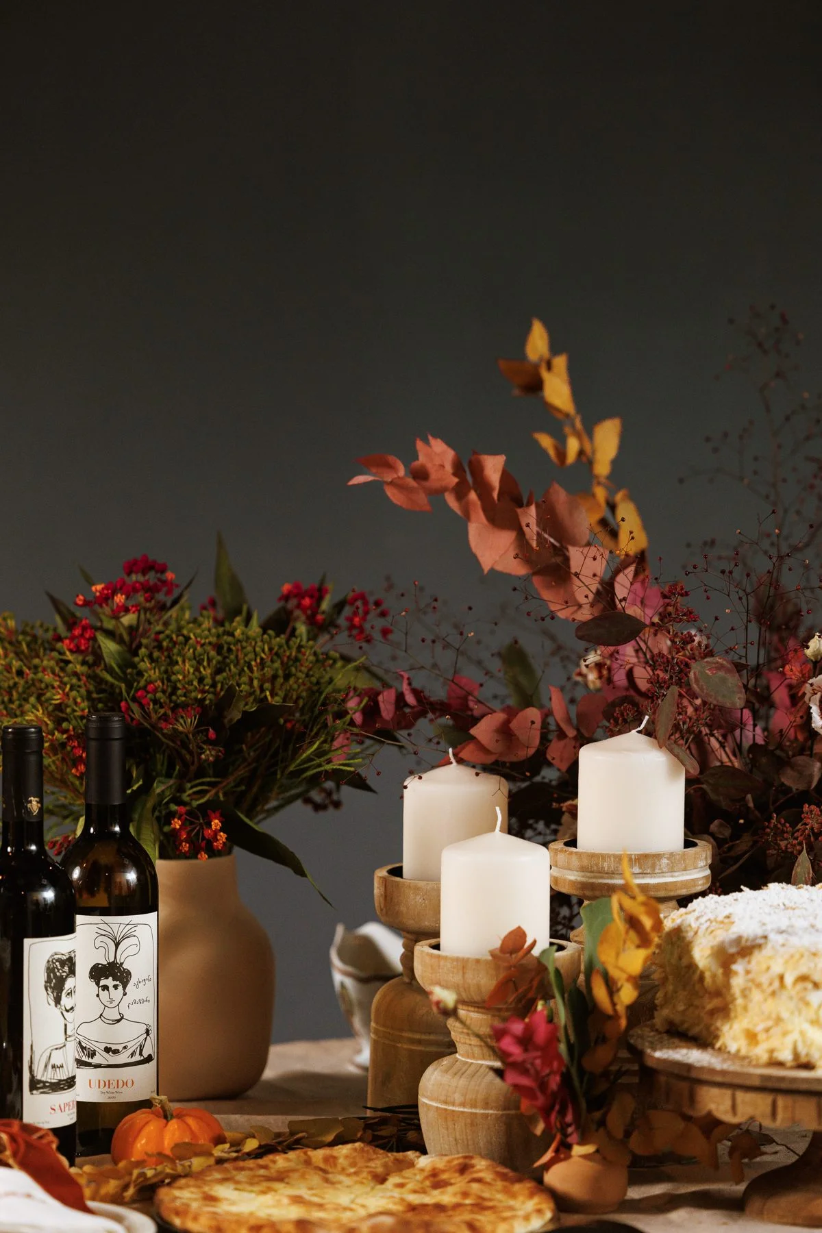 Autumn supra table set with Georgian wine and candles