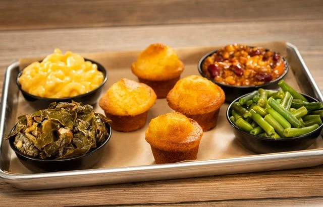 Southern-style comfort food platter with cornbread and sides